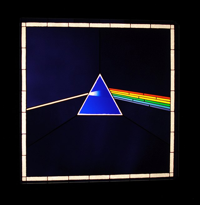 A reproduction the album cover for Pink Floyd's 'Dark Side of the Moon' in stained glass
