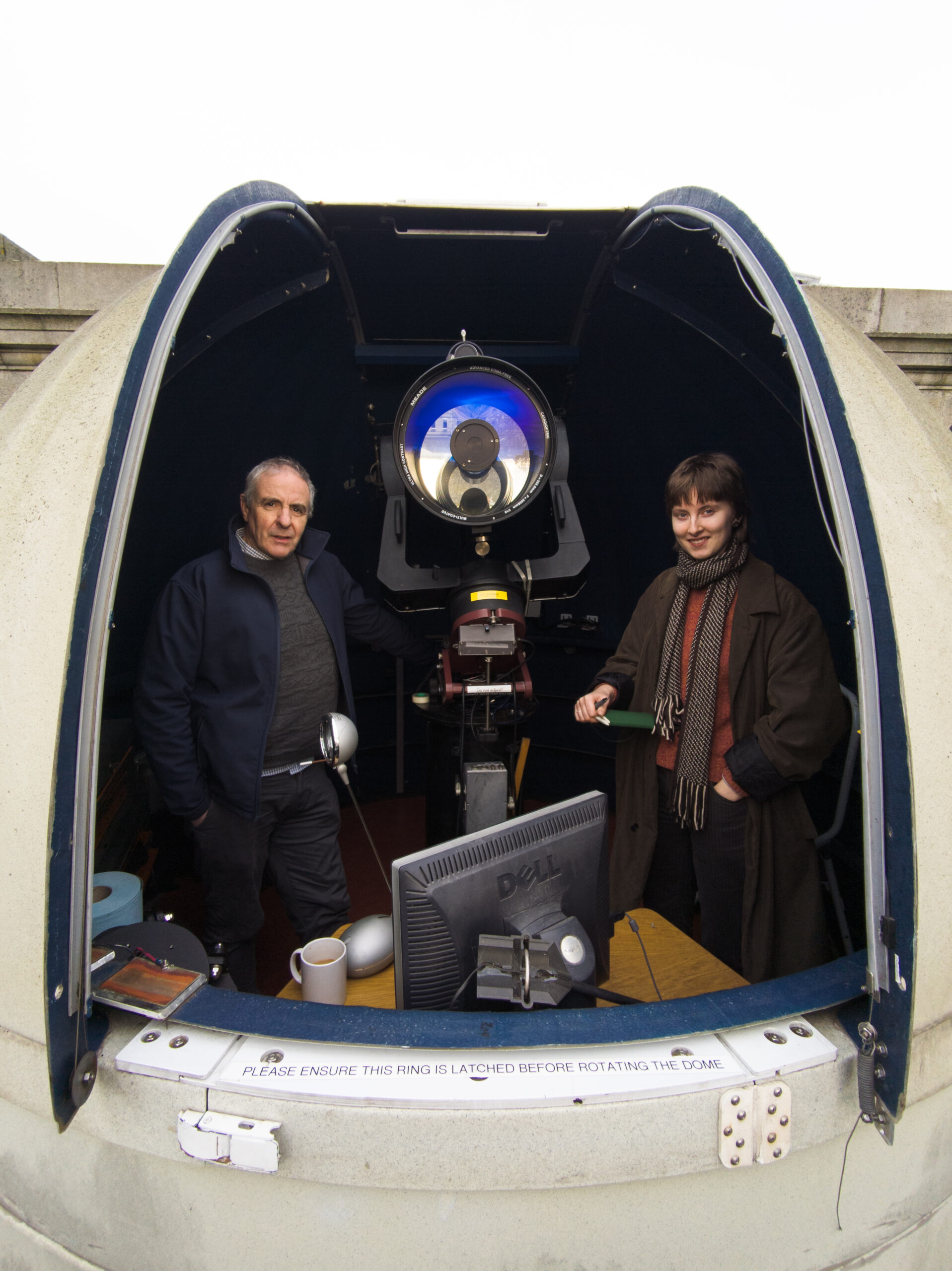 Joe McCauley and Alice Gogarty stand inside the Monck Observatory